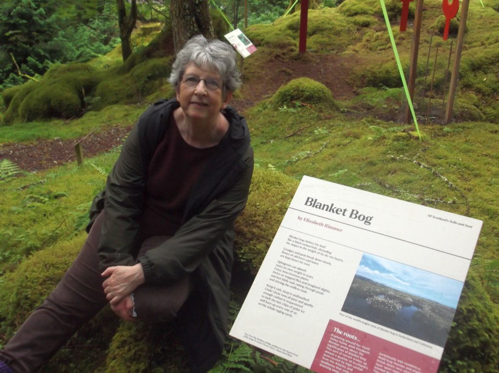 self portrait next to storyboard with the text of Blanket Bog