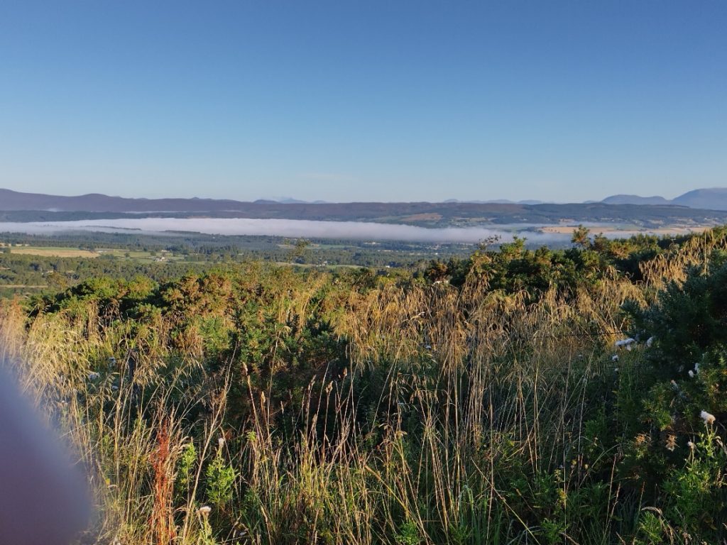 landscape looking to distant mountains. A cloud inversion fills the valley
